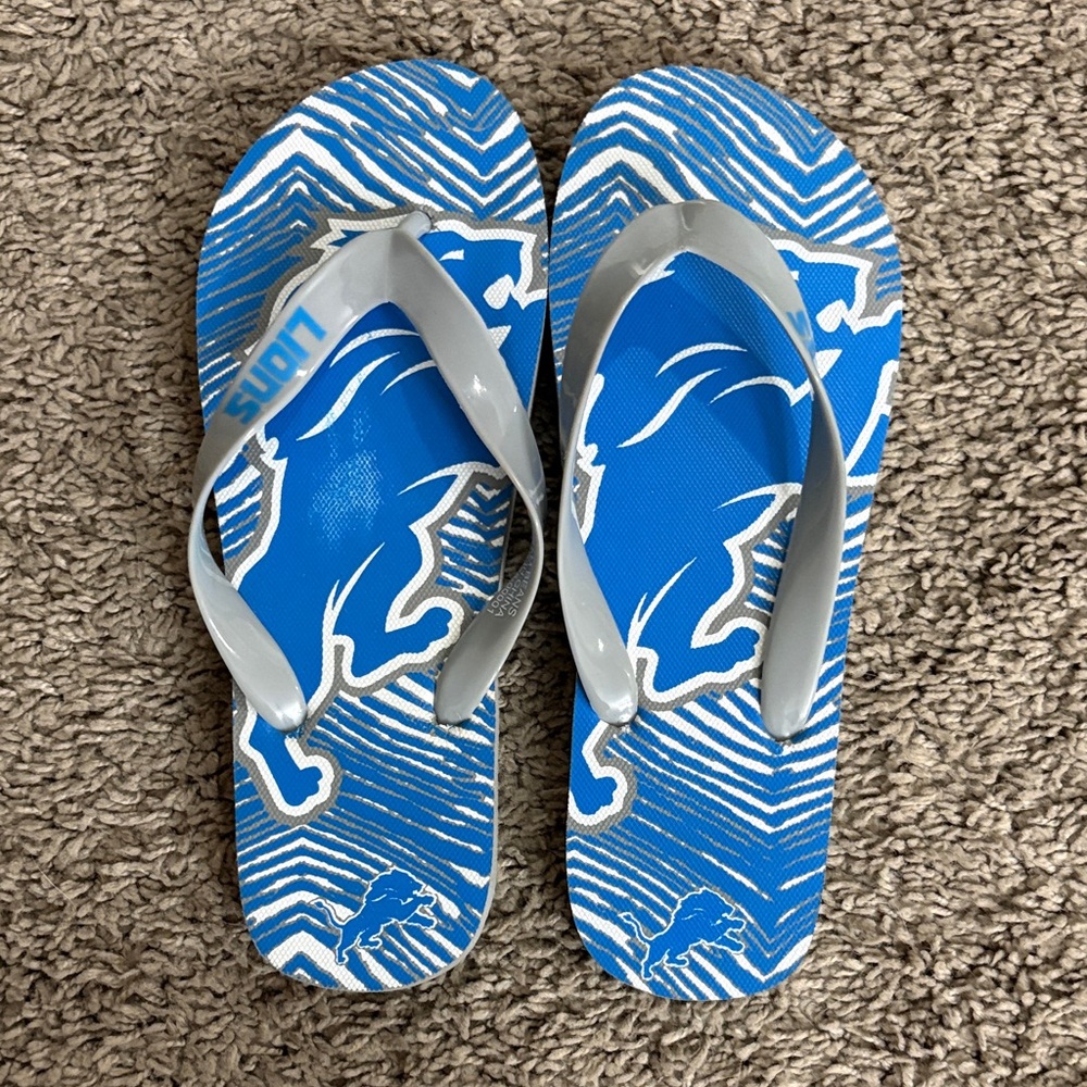 Blue and Gray Flip Flops with Lion Design